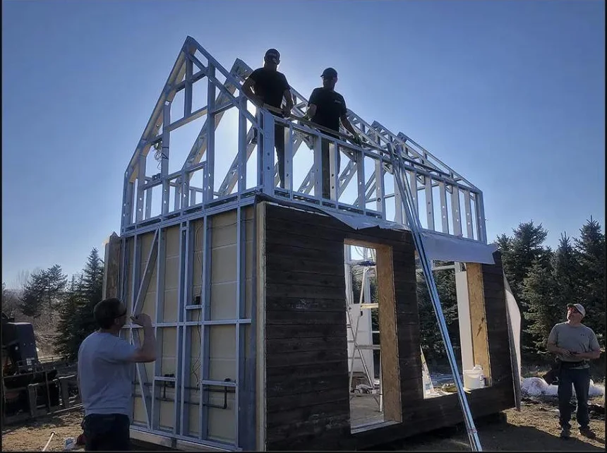 Global Haven crew standing up a steel frame on site